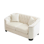 Canapé 2 places chesterfield en velours gris avec cloutage