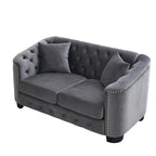 Canapé 2 places chesterfield en velours gris avec cloutage